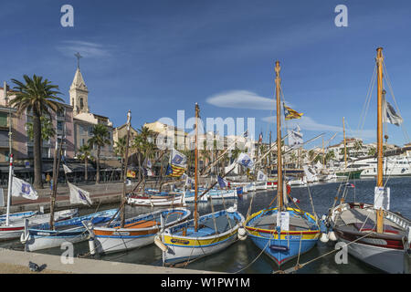 Mediterranean Fishing boats at Sanary-Sur-Mer , Promenade, Mistral Clouds, French Riviera, Cote d Azur, France Stock Photo