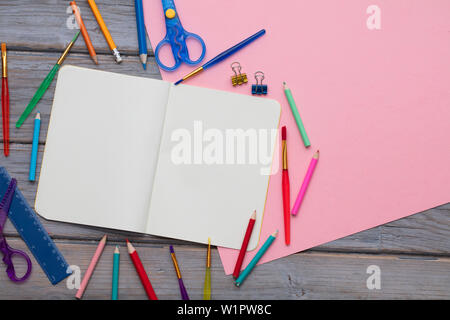 Pink School Supplies and White Blank Notepad on Pastel Blue Background.  Overhead Stock Image - Image of pencil, desk: 187992445