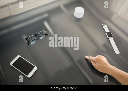 close up of hand using black interactive panel Stock Photo