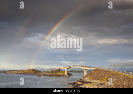 Rainbow over the bridge Storseisund on the Atlantic Ocean Road between Molde and Kristiansund, near Vevang, More og Romsdal, Western Norway, Norway, S Stock Photo