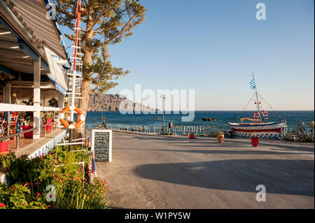 seafront in the evening with restaurant, Plakias, Crete, Greece, Europe Stock Photo