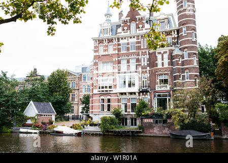 Nice Dutch Brick Architecture, House at Canal, Amsterdam, Netherlands, Europe Stock Photo