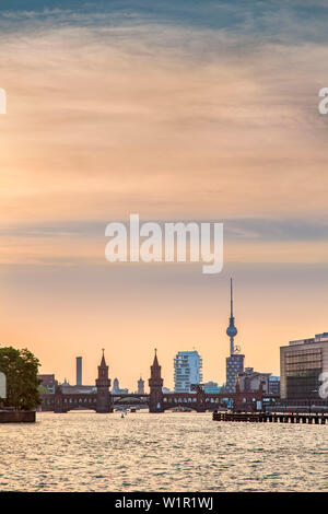 Sunset over the River Spree, view toward Oberbaum bridge and TV tower, Kreuzberg, Berlin, Germany Stock Photo