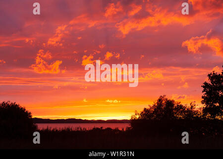 Dramatic Sunset at Rödl Gries on Lake Chiemsee for overseas Stock Photo