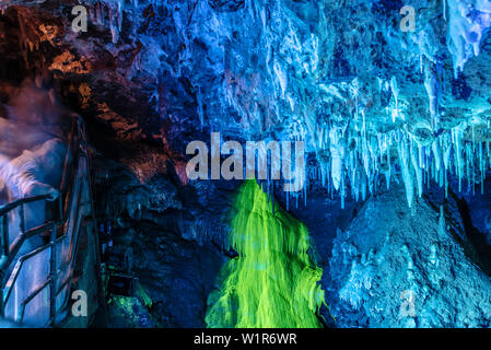 Stalactites and Stalagmites lit up in a cave, Grotte de Saint-Cezaire, Provence-Alpes-Cote d'Azur, France Stock Photo