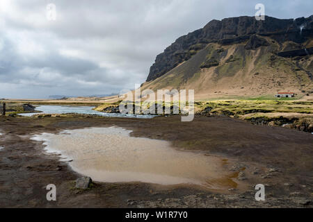 Dramatic landscape of rocky mountains and clouds in the southeastern region of Iceland along the Ring Road Stock Photo