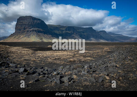 Dramatic landscape of rocky mountains and clouds in the southeastern region of Iceland along the Ring Road Stock Photo