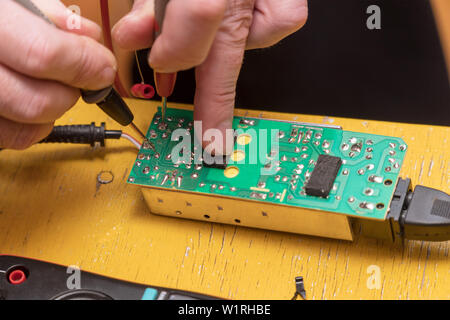 Repair of electronic board Stock Photo