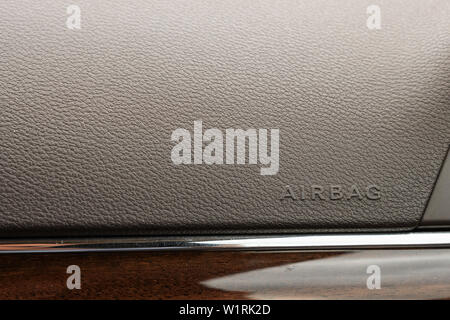 Description: Inscription on the panel of the vehicle airbag. background of grey textured plastic close-up Stock Photo