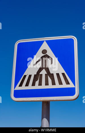 Pedestrian crossing road traffic sign showing a person on a zebra