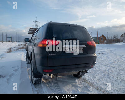 Moscow, Russia - March 24, 2019: Black Mitsubishi Pajero Sport in winter weather Внедорожник Митсубиси Паджеро спорт припаркован зимой на снегу Stock Photo