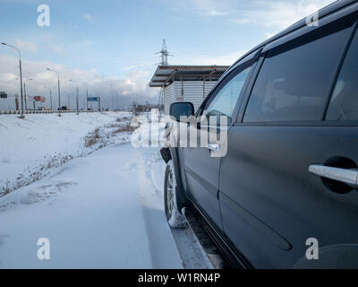 Moscow, Russia - March 24, 2019: Black Mitsubishi Pajero Sport in winter weather Внедорожник Митсубиси Паджеро спорт припаркован зимой на снегу Stock Photo