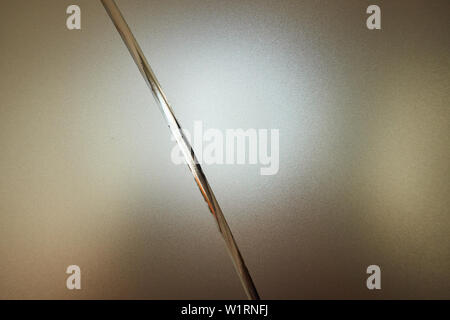 Frosted glass with decorative pattern, back light. Stock Photo