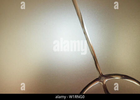 Frosted glass with decorative pattern, back light. Stock Photo