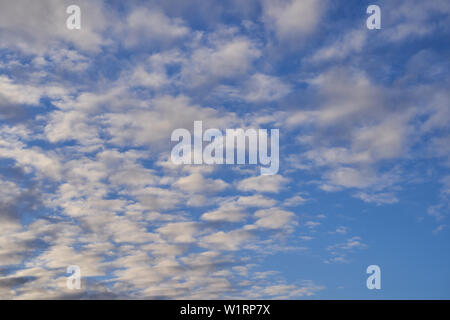 Blue sky with lots of small clouds. Stock Photo