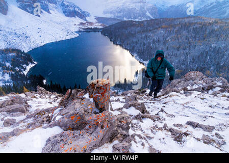 Man hiking in winter weather conditions, the Nublet, Mount Assiniboine Provincial Park, British Columbia, Canada