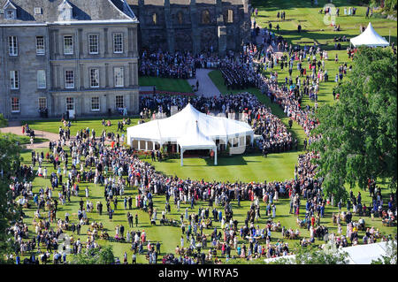 Edinburgh, UK. 3 July 2019.  Her Majesty The Queen has hosted her annual garden party at The Palace of Holyroodhouse in Edinburgh during Royal Week in Scotland.  Her Majesty The Queen's Garden Party was attended by people from all backgrounds and walks of life.  The sun made a fantastic appearance and the band played upbeat music and some covers of well known numbers.  Guests enjoyed afternoon tea with gourmet sandwiches, cakes and royal chocolates. Credit: Colin Fisher/Alamy Live News Stock Photo