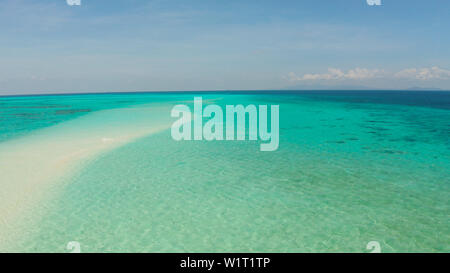 Island with a sandy beach and azure water surrounded by a coral reef and an atoll, aerial view. Mansalangan sandbar, Balabac, Palawan, Philippines. Summer and travel vacation concept Stock Photo