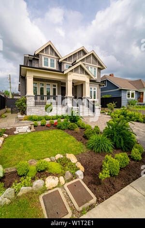 Residential house with modern paved front garden Stock Photo - Alamy