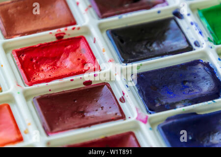 Creative artistic education concept - the box with the set of colorful watercolor paint close up Stock Photo