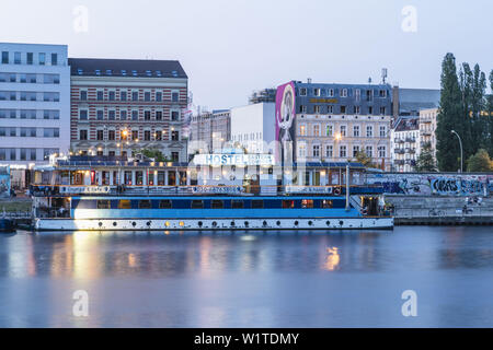 Floating Lounge and Hostel at riverside Spree, near Oberbaum bridge, East Side Hotel, Friedrichsshain, Kreuzberg, Berlin Stock Photo