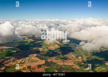 meadows and fields seen through a hole in the clouds eats of Madrid, Spain Stock Photo