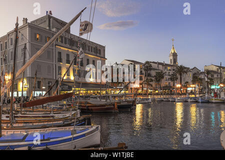 Mediterranean Fishing boats at Sanary-Sur-Mer , twilight, Promenade, Mistral Clouds, French Riviera, Cote d Azur, France Stock Photo