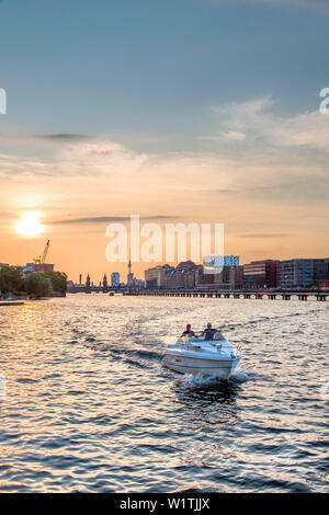 Sunset over the River Spree, view toward Oberbaum bridge and TV tower, Kreuzberg, Berlin, Germany Stock Photo