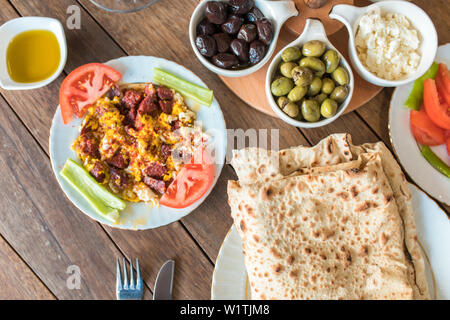 Traditional Turkish Breakfast Table. Turkish Breakfast Food Cuisine Culture. Turkish pide yufka ekmek, tea, bagel, borek, sikma, cheese, olives. Stock Photo