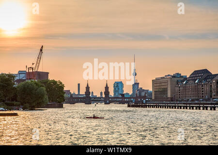 Sunset over the River Spree, view toward Oberbaum bridge and TV tower, Kreuzberg, Berlin, Germany Stock Photo