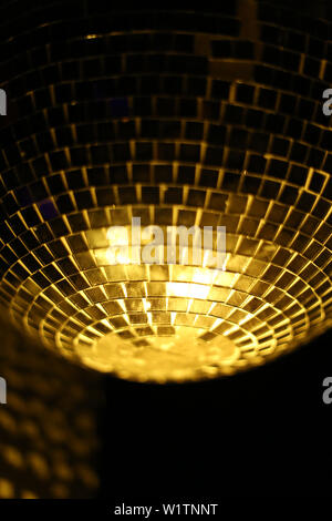 Detail of a gold disco ball light in a dance nightclub Stock Photo