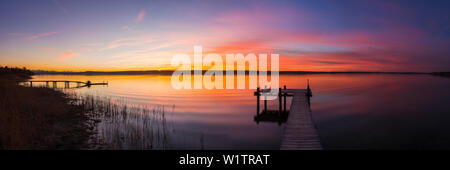 panoramic view of a colorful sunset at lake Ammersee, Bavaria, Germany Stock Photo