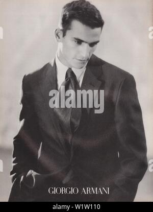 poster advertising Giorgio Armani male model in paper magazine from ...