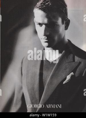 poster advertising Giorgio Armani male model in paper magazine from ...