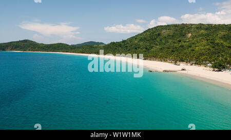 Aerial view of Nacpan Beach, tropical beach in El Nido with palm trees and chystal water Stock Photo