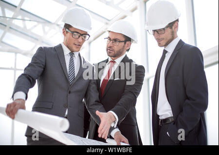 businessman asks questions to the chief architect Stock Photo
