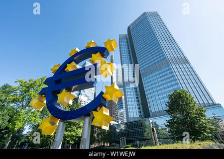 Frankfurt, Germany. July 2019.  the monument of the euro symbol in front of the Eurotorre building Stock Photo