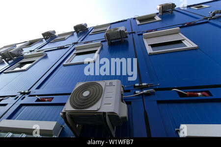 Bucharest, Romania - October 17, 2018: Several air conditioners are mounted on the wall of a building in Bucharest. This image is for editorial use on Stock Photo