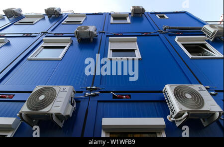 Bucharest, Romania - October 17, 2018: Several air conditioners are mounted on the wall of a building in Bucharest. This image is for editorial use on Stock Photo