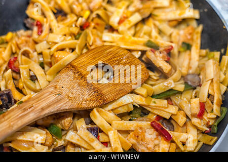 Bami Goreng is a pasta dish. Dish is made on a indonesian way with chicken brast and pasta. Stock Photo