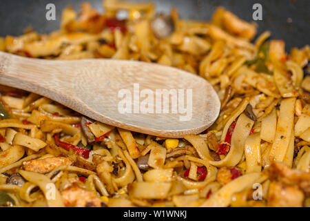 Bami Goreng is a pasta dish. Dish is made on a indonesian way with chicken brast and pasta. Stock Photo