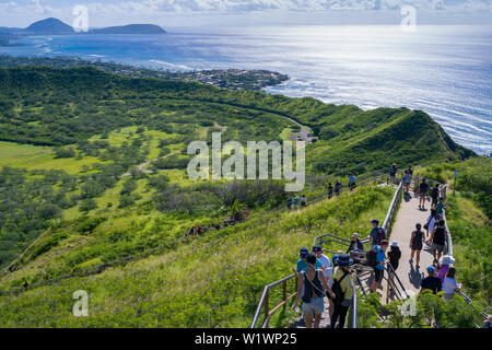 Tourists hike to top of Diamond Head to see old artillery bunkers of view of  Koko Head distant. Stock Photo