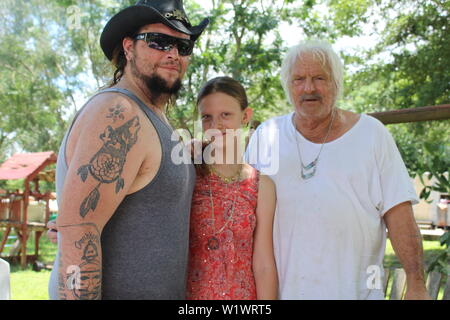 3 generations of my family; My father, myself, and my oldest daughter. My father is on the far right, I am on the left, and my 13 year old daughter. # Stock Photo