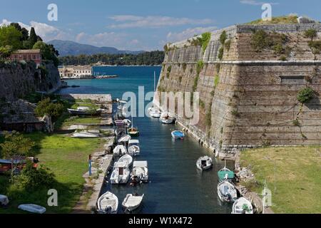 Old Venetian fortress, Martinengo bastion and moat with fishing boats, Corfu City, island Corfu, Ionian Islands, Greece Stock Photo