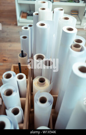 Paper rolls. Top view of paper rolls for manufacturing books standing in the wooden box Stock Photo