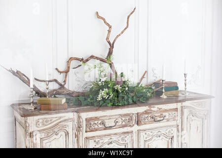 Spring decor for home library with green houseplant of aloe in ribbed black  pot, black books in soft light green mint menthe interior on white wood sh  Stock Photo - Alamy