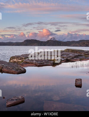 Suilven viewed across the sea at sunset, Wester Ross, Highland, Scotland Stock Photo