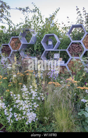 The Urban Pollinator Garden fuses design, function and wildlife-friendly values. It focuses on plants that encourage pollinators, specifically bees. Stock Photo