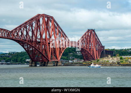 Inchcolm Island ferry Maid of the Forth passing under Forth Rail Bridge heading for Haws Pier in South Queensferry, Scotland, UK Stock Photo