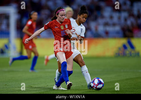 LYON, FRANCE - JULY 02: Rose Lavelle of the USA (L) and Lucy Bronze of England competes for the ball during the 2019 FIFA Women's World Cup France Semi Final match between England and USA at Stade de Lyon on July 2, 2019 in Lyon, France. (Photo by David Aliaga/MB Media) Stock Photo